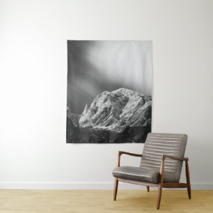 Misty clouds over the mountains in black and white tapestry