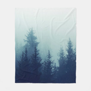 Misty fog in pine forest on mountain slopes. Color Fleece Blanket