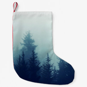 Misty fog in pine forest on mountain slopes. Color Small Christmas Stocking