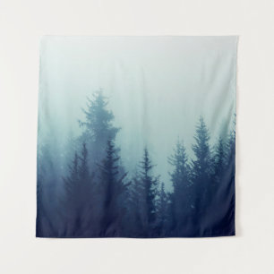 Misty fog in pine forest on mountain slopes. Color Tapestry