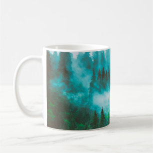 Misty foggy mountain landscape with fir forest and coffee mug
