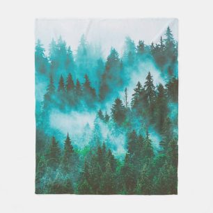 Misty foggy mountain landscape with fir forest and fleece blanket