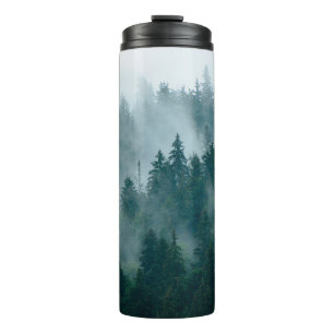 Misty landscape with fir forest in hipster vintage thermal tumbler