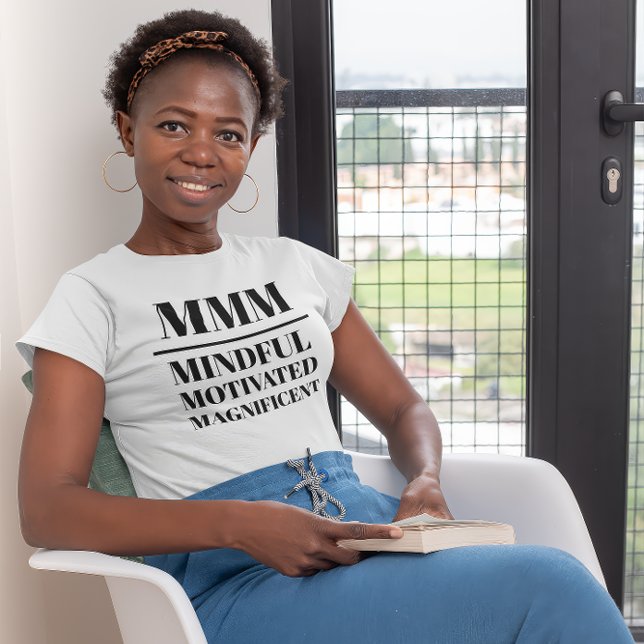 MMM- Mindful, Motivated, Magnificent T-Shirt (Young black woman wearing a "MMM:Mindful, Motivated, Magnificient" white t-shirt.)