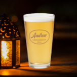 Mocha Stylised Wedding Groomsman Name Glass<br><div class="desc">Beer glass for the wedding groomsman that features his name printed in a trendy mocha colour, stylised script inside a mocha colour oval border along with wedding date. A great party supply idea for a bachelor party! Personalise your beer glass by editing and replacing name and date with your own....</div>