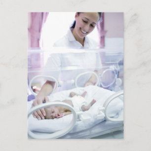 MODEL RELEASED. Nurse and premature baby. Postcard