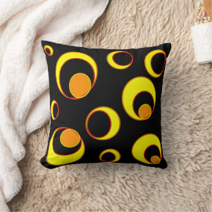 Modern abstract design, yellow circles on black cushion