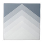 Modern and bold, triangle pattern tile<br><div class="desc">This modern wall tile features a striking chevron pattern composed of layered gradient stripes in elegant shades of grey and blue. Its clean lines and geometric shapes add depth and visual interest to the design. This tile is an excellent choice for bringing a sophisticated and stylish pop of personality to...</div>
