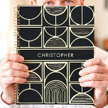 Modern Black and Gold Minimalist Planner<br><div class="desc">This sleek and modern design features a bold black background with an intricate geometric pattern in metallic gold. Clean lines and minimalist shapes create a stylish, sophisticated look, while the custom name in the centre adds a personal touch. Ideal for professionals, students, or anyone who appreciates contemporary and elegant aesthetics....</div>