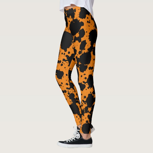 Modern Black and Orange Paint Splatter Funny Leggings (Left)