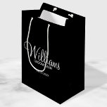 Modern Black and White Personalised Groomsman Medium Gift Bag<br><div class="desc">Modern Black and White Personalised Groomsman Gifts
featuring personalised groomsman's name in white modern script font style with title and wedding date in modern sans serif font style on black background.

Also perfect for best man,  father of the bride,  bridesmaid,  maid of honour,  mother of the bride and more.</div>