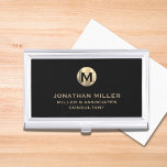 Modern Black Brushed Metallic Gold Monogram Business Card Holder<br><div class="desc">Elevate your professional look with this stylish and practical business card case. Featuring a brushed monogram medallion with your name company and title in classic block typography, this case is a great way to keep your business cards organised and protected. The black background adds a touch of sophistication, while the...</div>