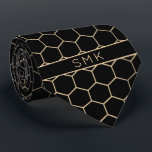 Modern Black Gold Foil Geometric Monogram Tie<br><div class="desc">Modern Black and Gold Foil Geometric Monogram Necktie in a stylish pattern of gold hexagons on an elegant black background. Easy to customise with text, fonts, and colours. Created by Zazzle pro designer BK Thompson © exclusively for Cedar and String; please contact us at cedarandstring@gmail.com if you need assistance, have...</div>