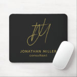 Modern Black Gold Monogram Mouse Mat<br><div class="desc">Keep your workspace stylish and functional with this Modern Black Gold Monogram Mouse Pad. The sleek design features a customisable monogram with name and title on a black background, and the non-slip rubber base ensures a secure grip on any surface. Perfect for both personal and professional use, this mouse pad...</div>