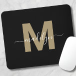 Modern Black Gold Script Name Initial Monogram Mouse Mat<br><div class="desc">Personalised Elegant Modern Black Gold Script Initial Name Monogram Mouse Pad. Add a touch of sophistication to your workspace with this chic mouse pad. It features a flat gold-coloured initial (without shimmer or foil) centred on a sleek black background. The refined design combines elegance with practicality, making it a perfect...</div>