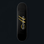 Modern Black Monogram Gold Script Name Skateboard<br><div class="desc">An elegant gold and white monogram on a rich black skateboard for your outdoor fun. Stylish,  and modern.</div>