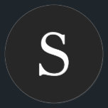 Modern Black Monogram Wedding Classic Round Sticker<br><div class="desc">Modern wedding stickers featuring a simple design with your one initial monogram in a white serif font over a black background. The background and font colours may be changed to any colours that you wish. A plain and basic design that still comes across as chic and stylish. These minimalist style...</div>