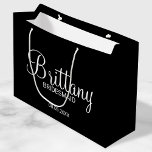 Modern Black Personalised Bridesmaids Large Gift Bag<br><div class="desc">Modern Personalised Bridesmaids Gifts
featuring personalised bridesmaid's name in white modern calligraphy font style with title and wedding date in white modern sans serif font style on black background.

Also perfect for Maid of Honour,  Flower Girl,  Mother of the Bride and more.</div>
