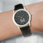 Modern Black White Monogram Watch<br><div class="desc">Personalised Monogram Black and White Watch with Simple White Numbers. This sleek, minimalist watch combines classic style with a personal touch, featuring a bold grey initial on a black face accented by simple white numbers for easy reading. The design includes a stylish white script name, adding a subtle, custom element...</div>
