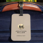 Modern Brushed Gold Monogram Beige Luggage Tag<br><div class="desc">A modern luxury vertical design in classic style with a brushed metallic gold monogram emblem with large typographic initial monogram on a neutral beige background. The text can easily be customised using the fields provided.</div>