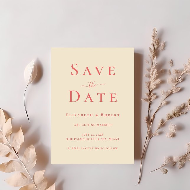 Modern Chic Soft Coral Typography Save the Date Invitation (Modern Chic Soft Coral Typography Save the Date Invitation on a table with dry soft pink flowers.)