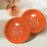 Modern Class of 2025 Script Orange Graduation Paper Plate<br><div class="desc">Add a personalised touch to your graduation party with these modern graduation paper plates! The paper plates feature a graduation cap at the top of the design with "Class of 2025" displayed in bold white lettering on an orange background. Personalise the orange graduation plates with the graduate's name, school, and...</div>