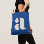 Modern Cobalt Blue Bold Retro Monogram Initial Tote Bag<br><div class="desc">A bold and contemporary tote bag featuring a deep blue background with a striking white lowercase letter in modern typography. Perfect for everyday use, shopping, work, or as a statement accessory, this eye-catching design blends minimalism with a retro-inspired aesthetic. Ideal for typography lovers and those who appreciate stylish, unique designs....</div>