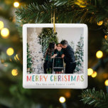 Modern & Colourful Merry Christmas Family Photo Ceramic Ornament<br><div class="desc">This simple and fun family Merry Christmas ornament features a place for you to add your names, with ‘Merry Christmas’ in colourful bright typography, as well as room for you to add your own photo. On a back is a matching colourful polka dot design. The perfect modern xmas holiday decor...</div>