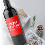 Modern Cool Classic Red Christmas Wine Label<br><div class="desc">A classic Christmas Wine Label with a vibrant red colour. Featuring bold,  modern white text that reads "Merry Christmas, " alongside a personalised handwritten name or surname of the recipient,  making it a thoughtful and unique touch for holiday gifting.</div>