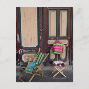 Modern day deck chairs and beach bags for sale postcard
