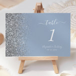 Modern Dusty Blue Silver Glitter Edge Wedding Table Number<br><div class="desc">The left-hand edge of this elegant modern wedding table number features a silver faux glitter design. The customisable text combines white handwriting,  copperplate and italic fonts on a dusty blue background.</div>