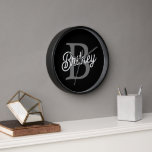 Modern Elegant Monogram Name  Black Grey Script  Clock<br><div class="desc">The Modern Elegant Monogram Name Black Grey Script Clock is a sophisticated addition to any space, blending functionality with style. Featuring a sleek black face with grey script, this clock is personalised with an elegant monogram and name, making it a unique and refined timepiece. Ideal for home or office settings,...</div>