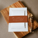 Modern Elegant Script Terracotta Wedding Invitation Belly Band<br><div class="desc">Elegant wedding invitation belly bands featuring "the wedding of" displayed in a white calligraphy script on a terracotta background. Personalise the modern wedding belly bands with your names and wedding date below in white lettering.</div>