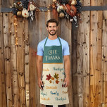 Modern Give Thanks Messages n Leaves Thanksgiving  Apron<br><div class="desc">This playful modern Thanksgiving design features various messages in a scripty type about gratitude, friends, and family, with "Give Thanks" in large fancy lettering at the top in ecru against a teal background. The messages in a script text surround a set of colourful red, gold, and burnt orange leaves. While...</div>