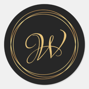 Modern golden circle on black monogram logo classic round sticker