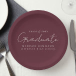 Modern Handwritten Script Maroon Graduation Paper Plate<br><div class="desc">Elevate your graduation party decor with our stylish graduation paper plates! Featuring a chic handwritten white script and a maroon background, these paper plates add a touch of sophistication to your celebration. Personalise them with the graduate's name, graduation year, and school name. Whether you're serving snacks or drinks, these plates...</div>