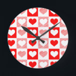 Modern Heart Pattern Wall Clock - Red and Pink<br><div class="desc">Make every second count with this stunning 'LOVE' inspired wall clock, featuring a vibrant geometric pattern of interlocking red and pink hearts. This decorative timepiece is the perfect blend of modern art and romantic functionality, designed to add a warm pop of color and a touch of sophisticated charm to your...</div>