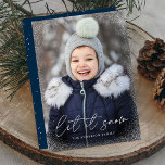 Modern Let It Snow Script Photo Holiday Card<br><div class="desc">Wish friends and family a happy holiday with a cute holiday photo card! The card features your vertical photo with subtle snow flurries bordering the card. "Let It Snow" is displayed in a white, trendy calligraphy script with your family's name below. The simple holiday card reverses to display white snow...</div>