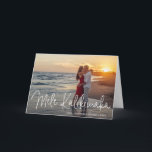 Modern Mele Kalikimaka Beach Photo Christmas Holiday Card<br><div class="desc">Send out holiday cheer with this modern folded Christmas card featuring a simple design with the Hawaiian greeting "Mele Kalikimaka" in an elegant thin white script, along with your names and year over your favourite photo. Add your personal message to the inside or delete the text if you want to...</div>