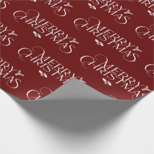Modern Merry Christmas text with holly, pine Wrapping Paper