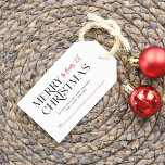 Modern Merry Christmas Typography Custom Family Gift Tags<br><div class="desc">A personalised Christmas gift tag. This elegant design features 'Merry Christmas' in elegant serif typography. Your family name is written in red script in the top right-hand corner. Below, there is a custom message space. The back of the tags is decorated with a watercolor holly and pine pattern. Inspired by...</div>