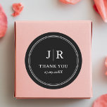 Modern Minimal Chic Black Custom Wedding Thank You Classic Round Sticker<br><div class="desc">Express gratitude with our "Modern Minimal Chic Black Custom Wedding Thank You Classic Round Sticker." Each sticker blends minimalist elegance with a personalised touch, creating a chic and timeless thank-you note for your wedding favours. Customise it with your names or wedding date for a bespoke keepsake that captures the essence...</div>