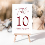 Modern Minimalist Burgundy Script Wedding Table Number<br><div class="desc">Elegant wedding table number card displaying the word "Table" in a burgundy handwritten script with the table number, your names, and wedding date shown below with a white background. The design repeats on the back. To order the table number cards, simply type each number and add it to your cart....</div>