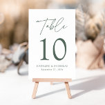 Modern Minimalist Dark Sage Green Script Wedding Table Number<br><div class="desc">Elegant wedding table number card displaying the word "Table" in a dark sage green handwritten script with the table number, your names, and wedding date shown below with a white background. The design repeats on the back. To order the table number cards, simply type each number and add it to...</div>