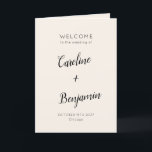 Modern Minimalist Ivory Cream Black Wedding Programme<br><div class="desc">Welcome guests to your wedding day with this beautifully designed ivory cream and black folded program that combines simplicity and sophistication. The elegant cover features customisable names and event details in graceful typography, while the inside includes a preformatted template to outline your ceremony and wedding party details. The back is...</div>