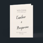 Modern Minimalist Ivory Cream Black Wedding Programme<br><div class="desc">Welcome guests to your wedding day with this beautifully designed ivory cream and black folded program that combines simplicity and sophistication. The elegant cover features customisable names and event details in graceful typography, while the inside includes a preformatted template to outline your ceremony and wedding party details. The back is...</div>