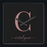 Modern Minimalist Rose Gold Monogram Script Name Square Wall Clock<br><div class="desc">Chic Elegant Pink Rose Gold Monogram Script on a chic Black Wall Clock. Easy to customise with your own name and details. Perfect for your luxury lifestyle! Please contact us at cedarandstring@gmail.com if you need assistance with the design or matching products.</div>