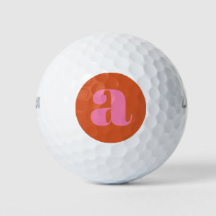 Modern Monogram Initial Letter Pink and Orange Golf Balls