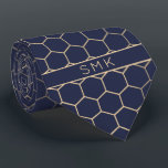 Modern Navy Blue Gold Foil Geometric Monogram Tie<br><div class="desc">Modern Navy Blue Gold Foil Geometric Monogram Necktie in a stylish pattern of stylish gold hexagons on an elegant navy blue background. Easy to customise with text, fonts, and colours. Created by Zazzle pro designer BK Thompson © exclusively for Cedar and String; please contact us at cedarandstring@gmail.com if you need...</div>