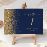 Modern Navy Blue Gold Glitter Edge Wedding Table Number<br><div class="desc">The left-hand edge of this elegant modern wedding table number features a gold faux glitter design. The customisable text combines pale gold-coloured handwriting,  copperplate and italic fonts on a navy blue background.</div>